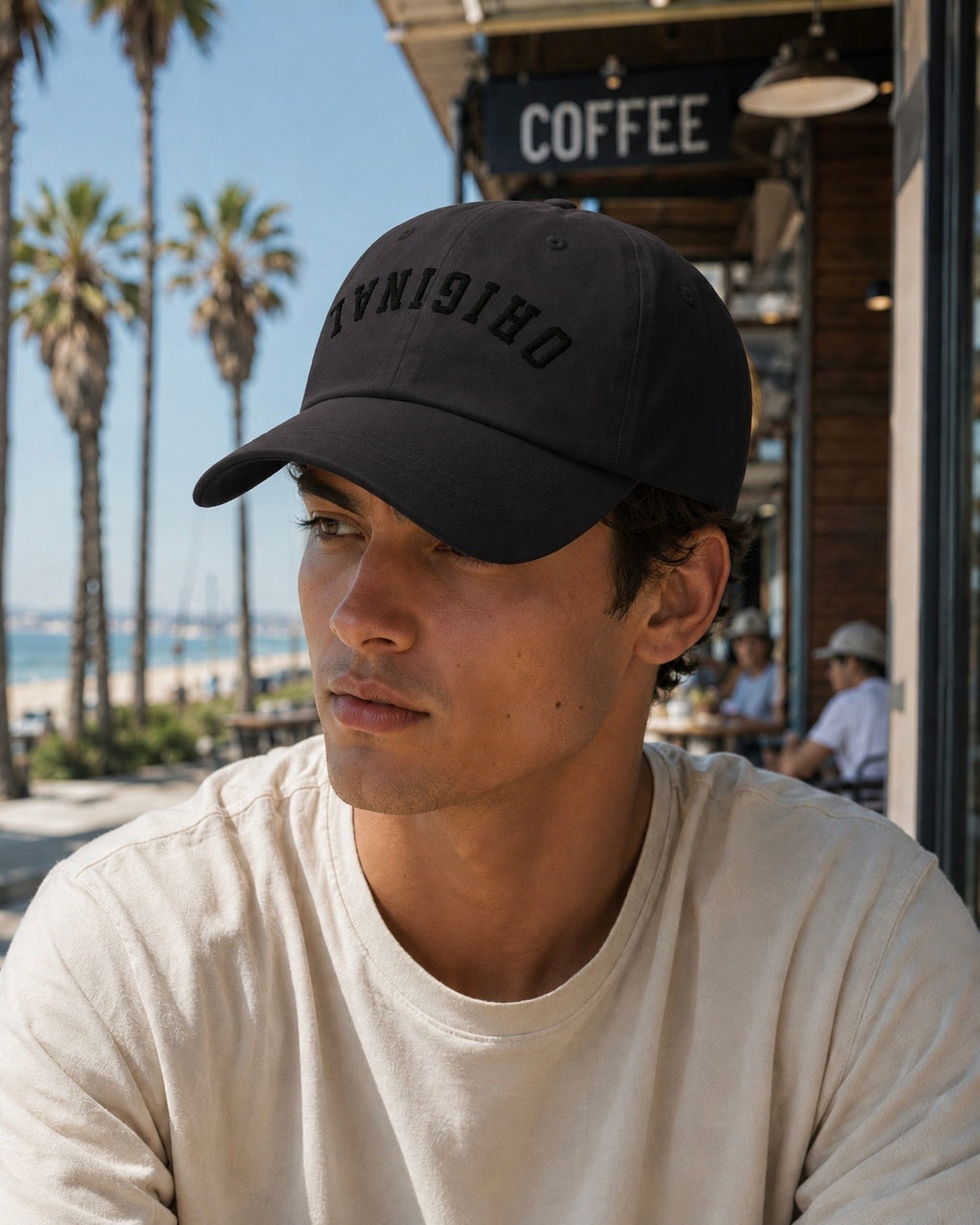 Dark dad hat worn on head, curved brim, bold front lettering logo