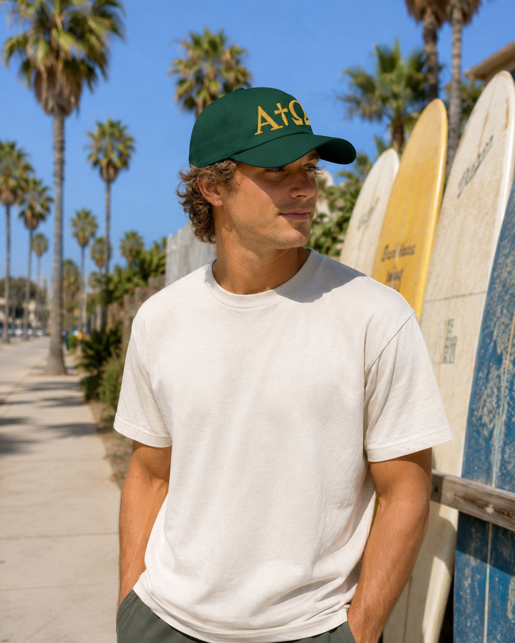 Green dad hat with gold ALPHA + OMEGA logo