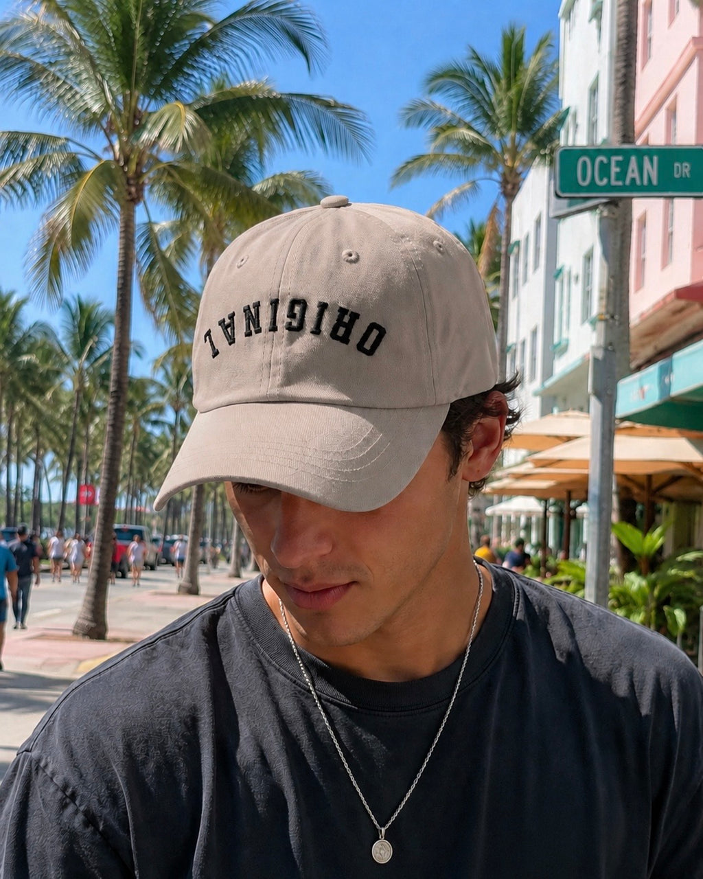 Stone dad hat worn on head, curved brim, bold front lettering logo