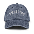 Navy vintage baseball cap with distressed front lettering and curved brim.