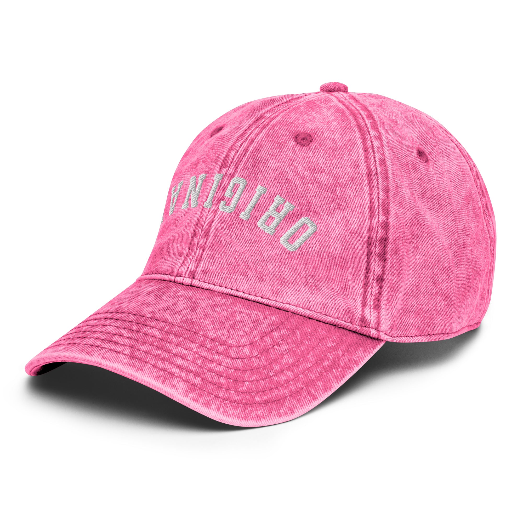 Pink vintage baseball cap with distressed side lettering and curved brim.