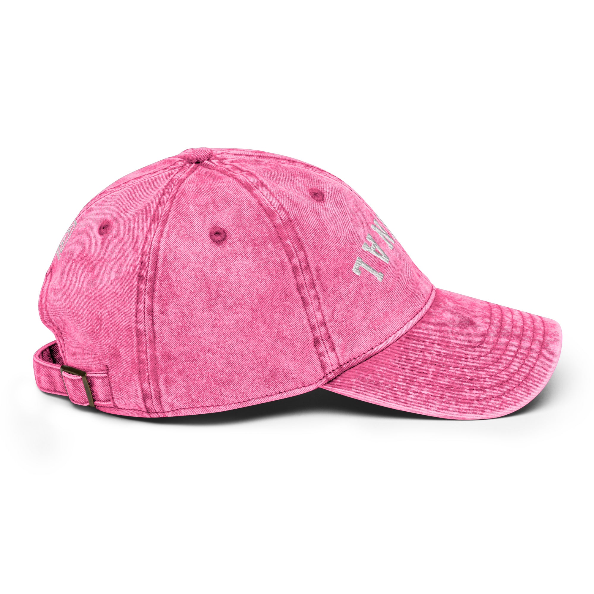 Pink vintage baseball cap with distressed side lettering and adjustable back strap.