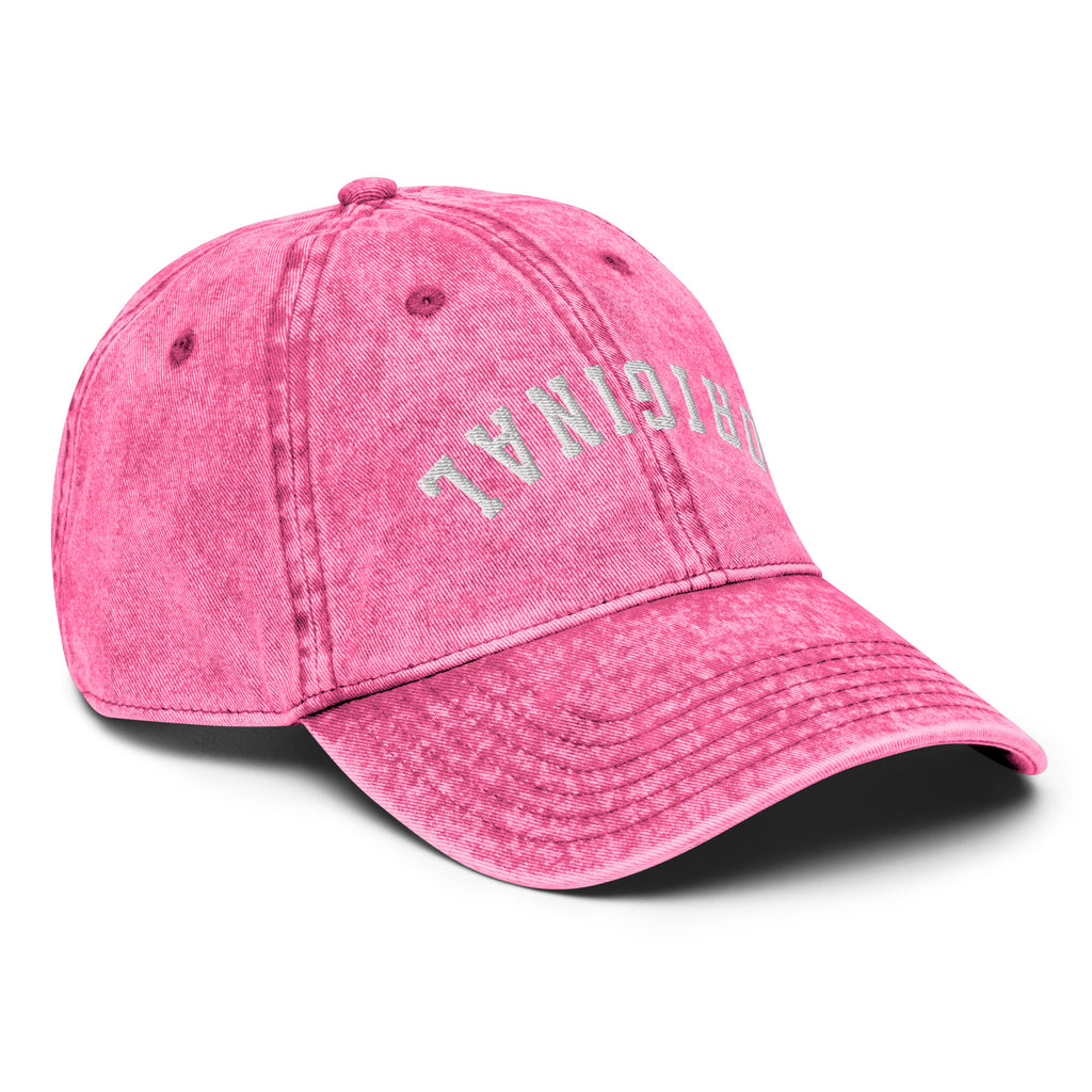 Pink vintage baseball cap with distressed front lettering and curved brim.